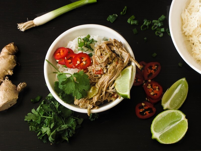 Thai Green Curry Pulled Pork in the slow cooker isn't a big hearty dish. Served with white rice, veggies & garnishes, it's simple and fresh-tasting.