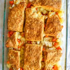 Leftover turkey doesn't have to be boring! Turn it into this simple pot pie topped with flaky biscuits and packed with vegetables.