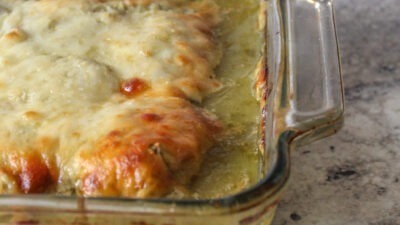 Bright green salsa verde over tender cooked chicken, topped with a shower of melty cheese. This easy weeknight chicken dinner is a winner.