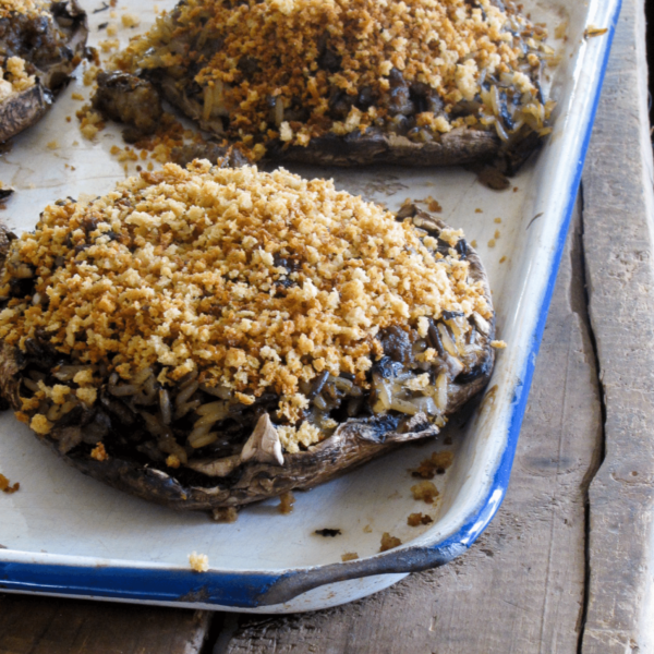 Stuffed portobello mushrooms with wild rice, sausage, crispy panko topping. Includes easy instructions to prep and freeze!