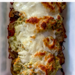 Twice baked potatoes mashed with pesto and then topped with melty swiss cheese! Freezes and reheats great, for a delish home lunch.