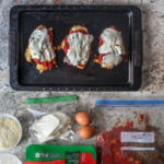 Chicken parm made on a sheet pan, prepped ahead of time, too! Crispy chicken smothered in zesty quick-made marinara and melty mozzarella.