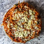Spaghetti tossed with sweet Italian sausage and then bound with egg & cheese, baked in a pie- a fun way to change up weeknight dinner!