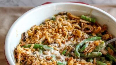 Skip the canned soup and make homemade green bean casserole from scratch! Packed with green beans, mushrooms, topped with fried onions.