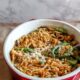 Skip the canned soup and make homemade green bean casserole from scratch! Packed with green beans, mushrooms, topped with fried onions.