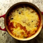 Baked rice and beans filled with black beans, corn, salsa, and made creamy with chicken broth. Topped with melty, yummy cheddar cheese!