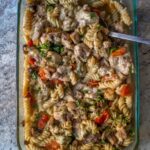 Toss dry rigatoni with tender chicken, zingy pesto, cherry tomatoes, mushrooms, and top it all with melty cheese. Easy weeknight pasta dinner!