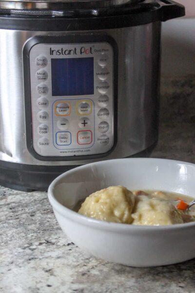 Instant Pot Chicken & Dumplings, with a creamy base, hearty vegetables, southern-style dumplings, tender bites of chicken- in under an hour!