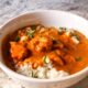 Homemade Indian Butter Curry made with tomato sauce, curry seasonings, and served over jasmine rice. Makes a great freezer meal!