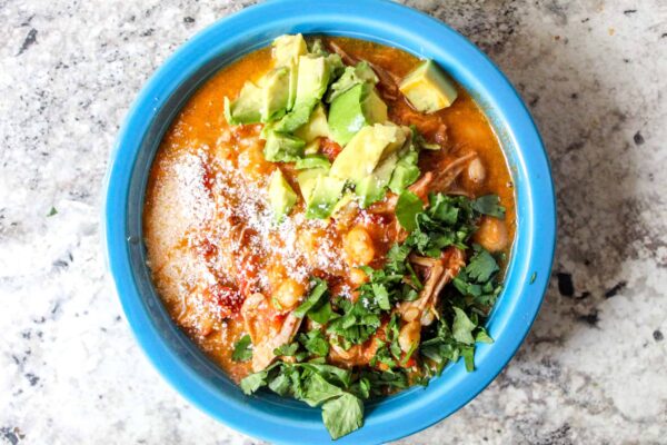 Discover the rich flavors of New Mexico with this authentic pozole-style pork stew recipe! Packed with tender pork, hominy, and bold spices, this comforting dish is perfect for cozy nights. Learn how to make this traditional favorite with easy step-by-step instructions. Cooks great in the slow cooker or Instant Pot, and freezes well, too!