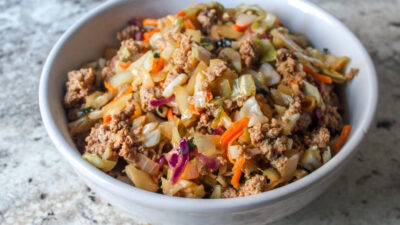 Egg Roll in a Bowl, with seasoned ground beef or pork, coleslaw mix, lime & ginger! Freezer meal for the Instant Pot, Crockpot, or stovetop.