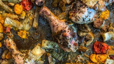 Sheet pan Italian chicken thighs, fennel, and cherry tomatoes tossed in a seasoning blend of basil, oregano, marjoram and garlic powder.