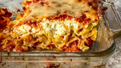 Easy-to-make lasagna with crumbled beef, creamy ricotta, mafalda noodles in place of lasagna sheets, and prepared pesto for a boost of flavor.