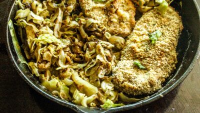 Crispy pork cutlets coated in panko breadcrumbs, served alongside creamy, warming cabbage cooked down in cream and chicken broth.