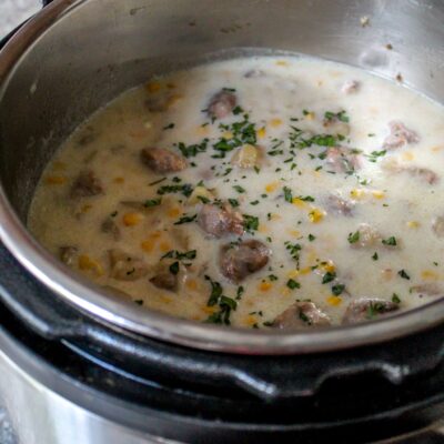Creamy potatoes, spicy sausage, and sweet pops of corn make this easy Instant Pot potato chowder a great meal prep for weeknights!