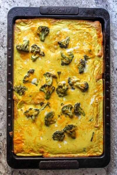 Great "Breakfast at Dinner" idea, or a sheet pan breakfast for a crowd! Use canned biscuit dough topped with a fluffy egg mixture and cheese.
